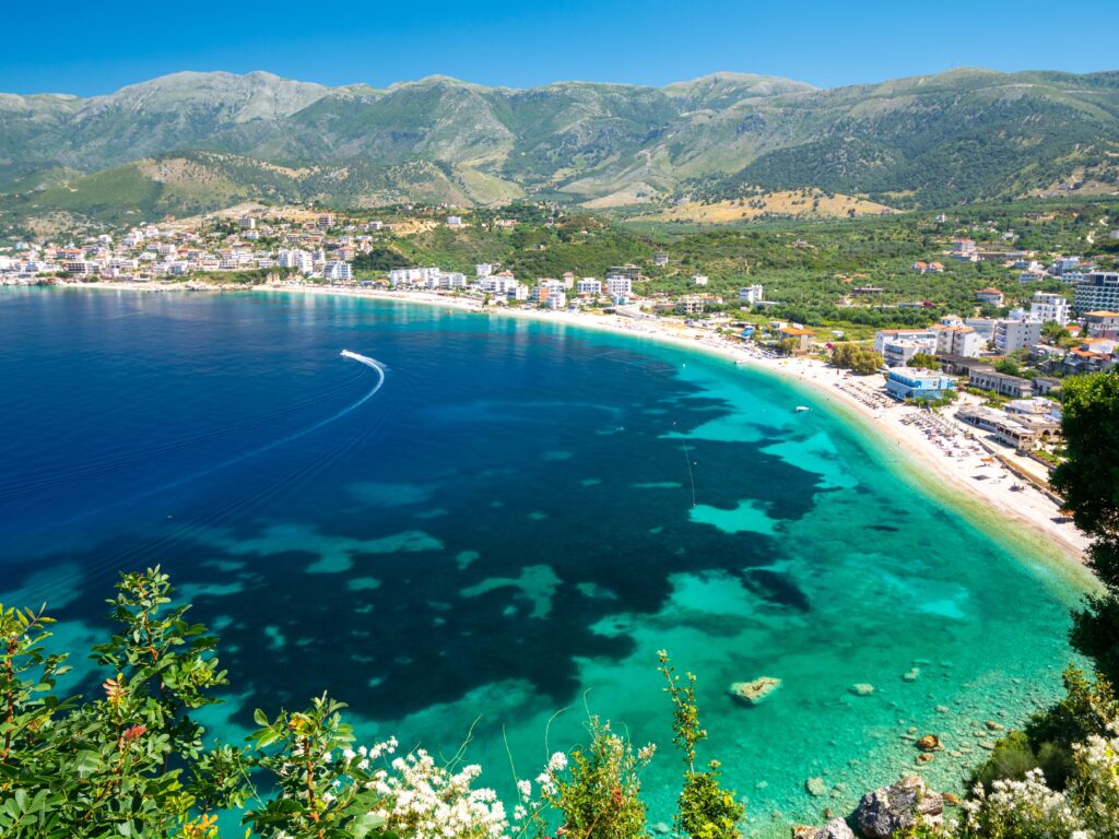 Rocky shoreline and blue water in Vlorë on coastal Albania group tours