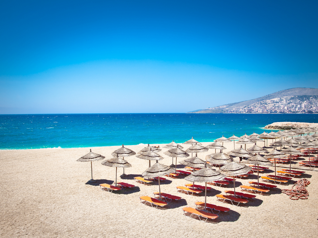 Clear blue water at Sarandë beach, popular stop on coastal Albania group tours